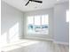 Well-lit bedroom with a modern ceiling fan and expansive windows providing natural light at 1142 Cottonsprings Dr, Wendell, NC 27591