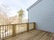 Spacious wooden deck with natural wood railing, perfect for outdoor entertaining and enjoying the scenery at 1142 Cottonsprings Dr, Wendell, NC 27591