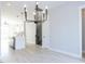 Modern living space with an open floor plan, seamlessly blending the kitchen and living areas at 1142 Cottonsprings Dr, Wendell, NC 27591