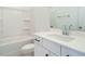 Bright bathroom featuring a white vanity, toilet, and shower-tub combination at 1146 Cottonsprings Dr, Wendell, NC 27591
