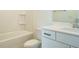 Clean, bright bathroom with white tub, toilet, vanity, and streamlined countertops at 1146 Cottonsprings Dr, Wendell, NC 27591