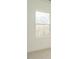 Neutral bedroom features plush carpeting, white walls, and large window with tree views at 1146 Cottonsprings Dr, Wendell, NC 27591