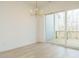 Bright dining room featuring a gold chandelier and sliding glass doors to a deck at 1146 Cottonsprings Dr, Wendell, NC 27591