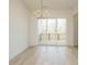 Bright dining room featuring a gold chandelier and sliding glass doors to a deck at 1146 Cottonsprings Dr, Wendell, NC 27591