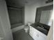 Clean bathroom featuring a tub, toilet and vanity at 3010 Freewinds Way # 43, Cary, NC 27519