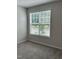 Bright bedroom featuring carpet, light walls, and a window with natural light at 3010 Freewinds Way # 43, Cary, NC 27519