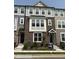 Charming townhome with a brick facade, light gray siding, and well-manicured landscaping at 3010 Freewinds Way # 43, Cary, NC 27519