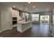 Modern kitchen featuring a center island, stainless appliances and access to a balcony at 3010 Freewinds Way # 43, Cary, NC 27519