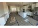 Modern kitchen with white cabinets and an island at 3010 Freewinds Way # 43, Cary, NC 27519