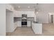 Modern kitchen featuring white cabinets, granite countertops and stainless appliances at 153 Wilderness Trl, Smithfield, NC 27577