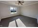 Well-lit bedroom with neutral carpeting and large window at 154 Wilderness Trl, Smithfield, NC 27577