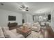 Open living space showcasing a ceiling fan, and hardwood floors at 7801 Otura Way, Raleigh, NC 27612