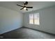 Spacious bedroom with neutral carpet and large window offering natural light at 50 Fetterbush Way, Clayton, NC 27520