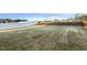 Large backyard with newly laid sod and a white vinyl fence at 573 Highview Drive Dr, Benson, NC 27504