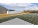 Spacious backyard featuring a white vinyl fence and a concrete patio at 573 Highview Drive Dr, Benson, NC 27504