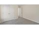 Well lit bedroom with carpeted floors, white trim and a closet with double doors at 573 Highview Drive Dr, Benson, NC 27504
