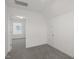 Carpeted bedroom featuring a door to an attic storage area and a window at 573 Highview Drive Dr, Benson, NC 27504
