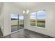 Open dining area featuring a sliding glass door and a large window with a view at 573 Highview Drive Dr, Benson, NC 27504