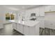 Bright open kitchen features a large island and stainless steel appliances with backyard view at 573 Highview Drive Dr, Benson, NC 27504