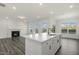 Open concept living room features fireplace, kitchen island and backyard view at 573 Highview Drive Dr, Benson, NC 27504
