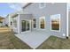 Concrete patio with sliding glass doors and gray siding at 573 Highview Drive Dr, Benson, NC 27504