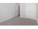 Bright bedroom with neutral walls, carpet flooring and double door closet at 607 Tuscany Cir, Princeton, NC 27569