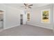 Bright bedroom with carpet flooring and large windows at 607 Tuscany Cir, Princeton, NC 27569