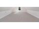 Large bonus room with carpeted floors and a window at 607 Tuscany Cir, Princeton, NC 27569