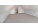 Spacious bonus room with carpeted floor, and access to attic at 607 Tuscany Cir, Princeton, NC 27569