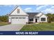 Charming new construction home featuring a two-car garage, manicured lawn, and modern design elements at 607 Tuscany Cir, Princeton, NC 27569
