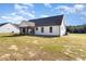 Back exterior view of the house, showcasing the screened porch at 607 Tuscany Cir, Princeton, NC 27569