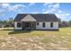Back exterior view of the house, showcasing the screened porch at 607 Tuscany Cir, Princeton, NC 27569