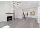 Spacious living room featuring hardwood floors and a fireplace at 607 Tuscany Cir, Princeton, NC 27569