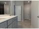 Bathroom with a gray vanity, double sinks, and large mirrors at 639 Sweet Potato Lane # 3, Nashville, NC 27856