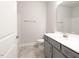 Modern bathroom featuring gray vanity, white countertop, and gray tile flooring at 639 Sweet Potato Lane # 3, Nashville, NC 27856