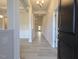 Bright foyer with light wood floors leading into the home's open-concept living spaces and a glimpse of coffered ceilings at 639 Sweet Potato Lane # 3, Nashville, NC 27856