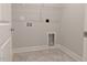 Practical laundry room featuring washer and dryer hookups, tiled floor and storage at 639 Sweet Potato Lane # 3, Nashville, NC 27856