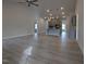 Open-concept living space with vaulted ceiling, gray cabinets, kitchen island, and modern lighting at 639 Sweet Potato Lane # 3, Nashville, NC 27856