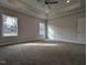 Spacious bedroom with tray ceiling, recessed lighting and windows overlooking backyard at 639 Sweet Potato Lane # 3, Nashville, NC 27856