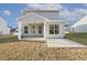 Back of the house with a covered patio and plenty of windows at 82 Gander Dr, Benson, NC 27504