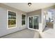 View of the covered patio and windows overlooking the backyard at 82 Gander Dr, Benson, NC 27504