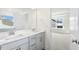 Modern bathroom with double vanity, a large mirror, and access to the bedroom at 82 Gander Dr, Benson, NC 27504