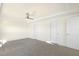 Spacious bedroom featuring a ceiling fan, plush carpet, and plenty of natural light at 82 Gander Dr, Benson, NC 27504