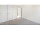 A light, carpeted bedroom with double door closet and white trim at 82 Gander Dr, Benson, NC 27504