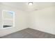 This carpeted bedroom features natural light and neutral walls at 82 Gander Dr, Benson, NC 27504