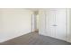 A carpeted bedroom with double closet and modern doors at 82 Gander Dr, Benson, NC 27504