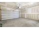A well-lit garage with a concrete floor and an insulated door ready for personalization at 82 Gander Dr, Benson, NC 27504