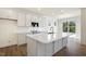 Kitchen featuring white cabinets, stainless appliances, and an island with a sink at 82 Gander Dr, Benson, NC 27504