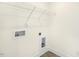 The laundry room includes hookups, shelves and durable flooring at 82 Gander Dr, Benson, NC 27504