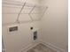 A laundry room with tile flooring and a wire rack shelf at 82 Gander Dr, Benson, NC 27504